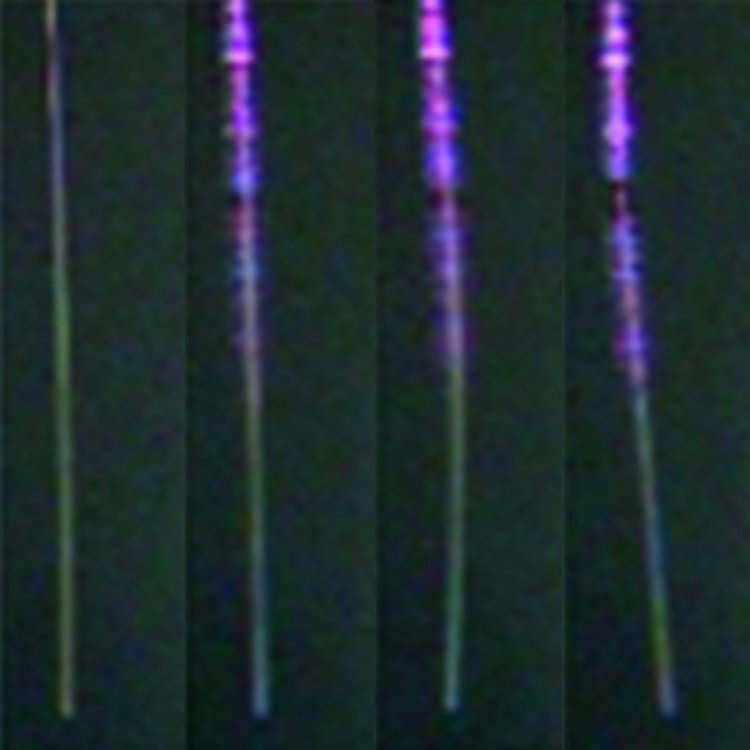 Is the light gaining momentum? The recoil of the fiber (from left to right) would suggest that the light is gaining momentum while exiting the fiber.